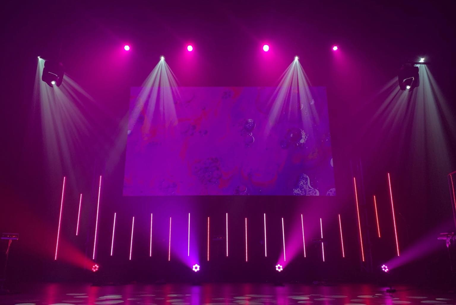 Shot of a stage lit up with purple and spotlights